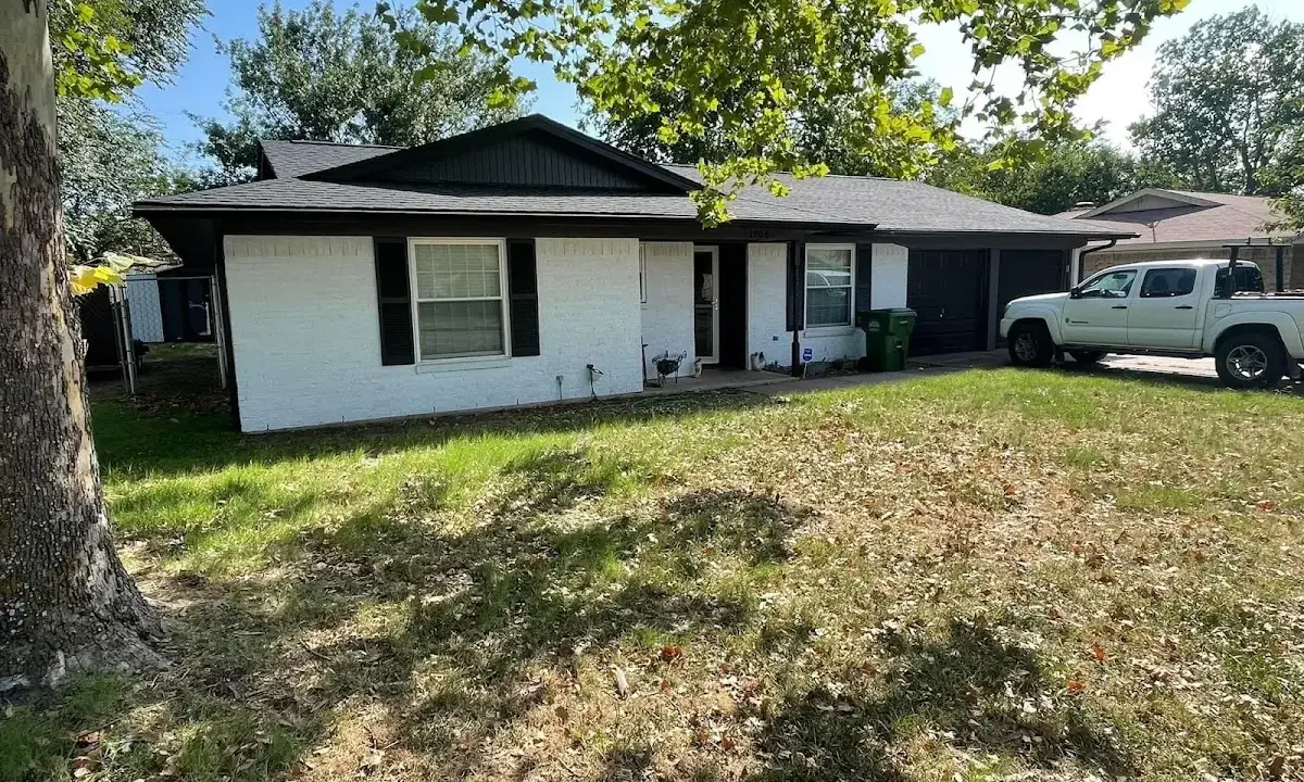 Professional roofing crew working on a residential roof in Sunrise